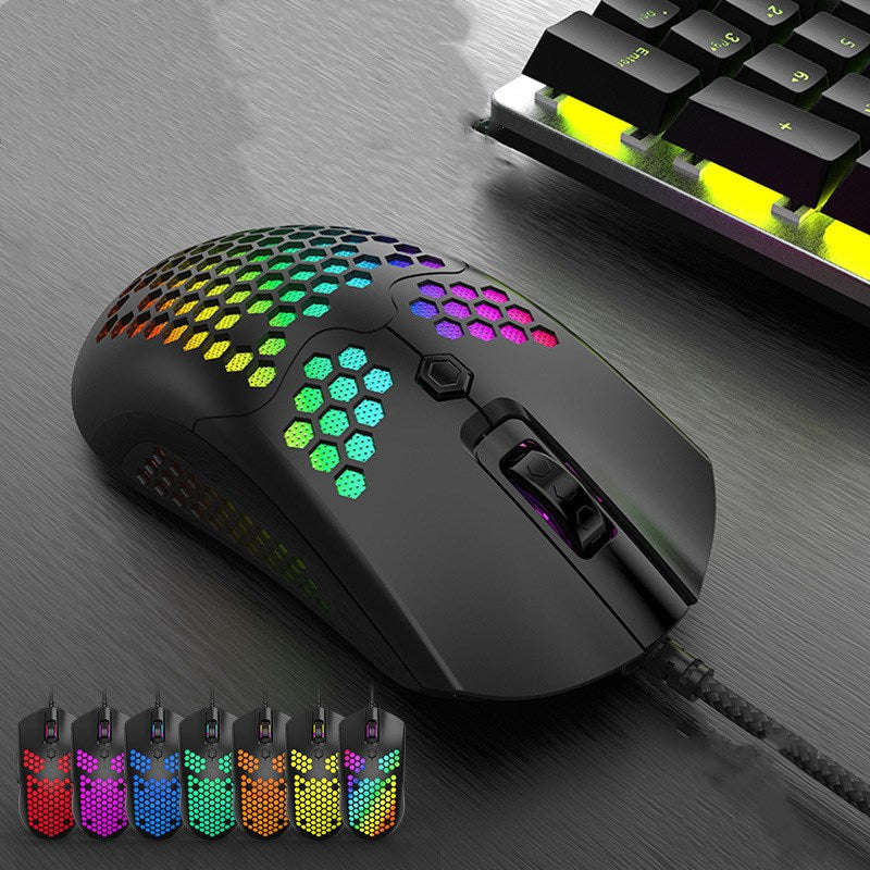 RGB wired gaming mouse with honeycomb shell in a clean desk setup