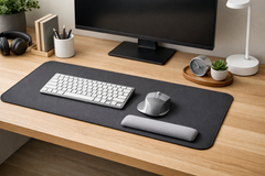 Desk setup with keyboard, mouse, wrist rest, and monitor