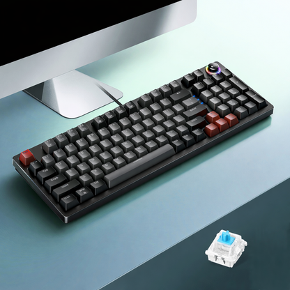 Black 96-key wired mechanical keyboard with control knob on a desk setup