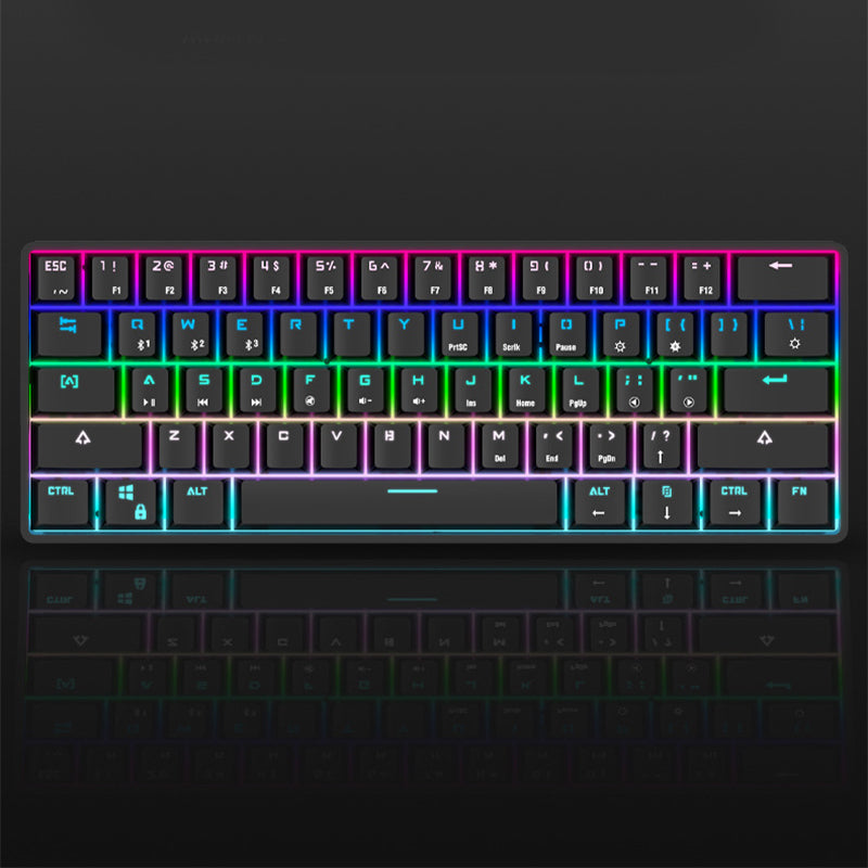 Compact wireless Bluetooth keyboard with RGB backlight on a laptop setup