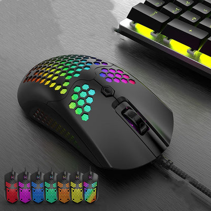 RGB wired gaming mouse with honeycomb shell in a clean desk setup