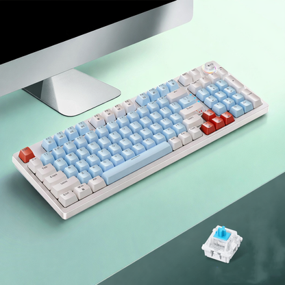 White 96-key wired mechanical keyboard with control knob on a clean desk setup